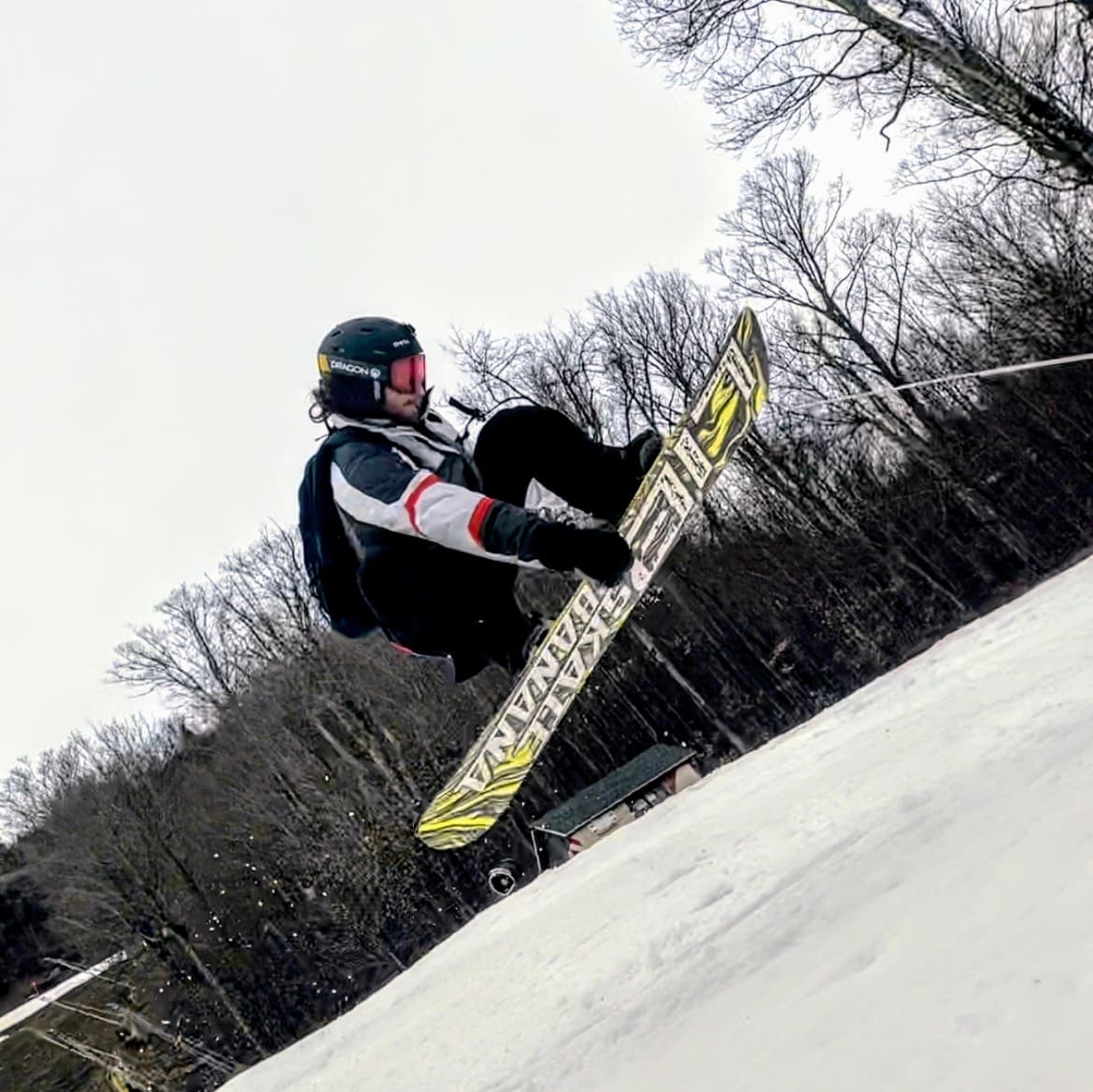 Nikolay Feldman doing a jump with his snowboard